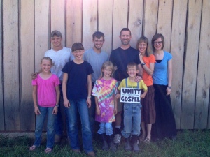recent family photo in front of the barn